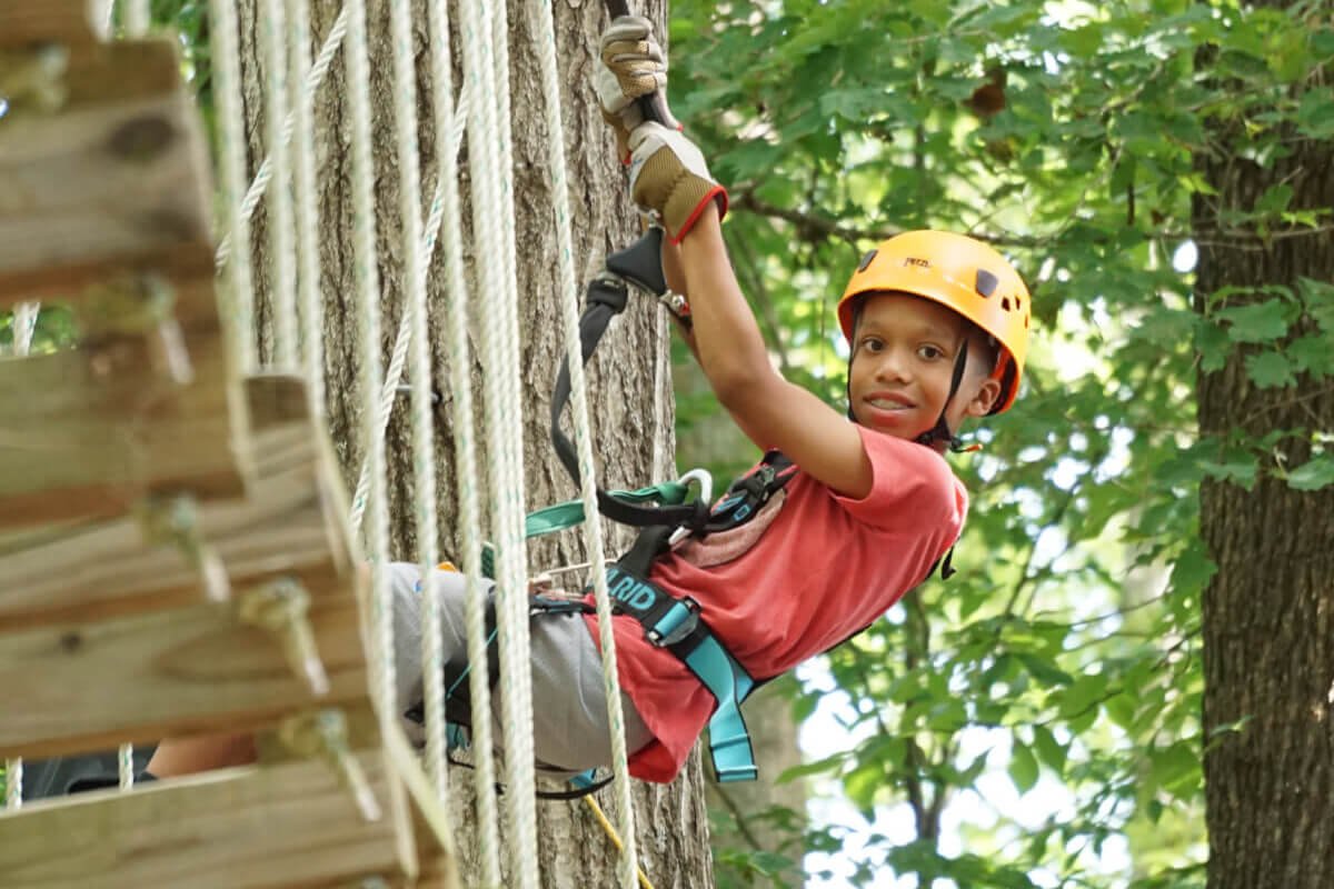 Campers working together on team challenges